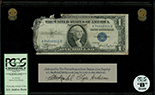 USA, $1 silver certificate, series 1935D, serial R81178009F, Clark-Snyder, in lucite display, PCGS Currency Grade B.