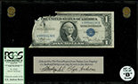 USA, $1 silver certificate, series 1935D, serial R81178009F, Clark-Snyder, in lucite display, PCGS Currency Grade B.